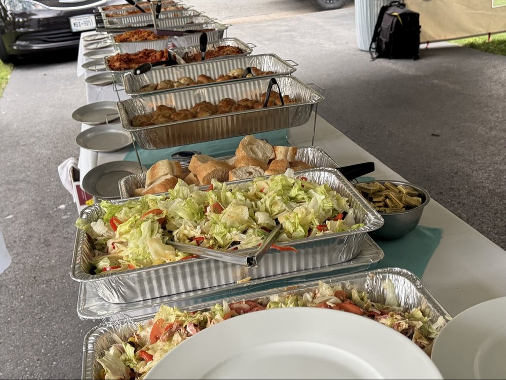 Italian catering buffet in Rochester, NY — Cinelli's salad, bread, and hot pans