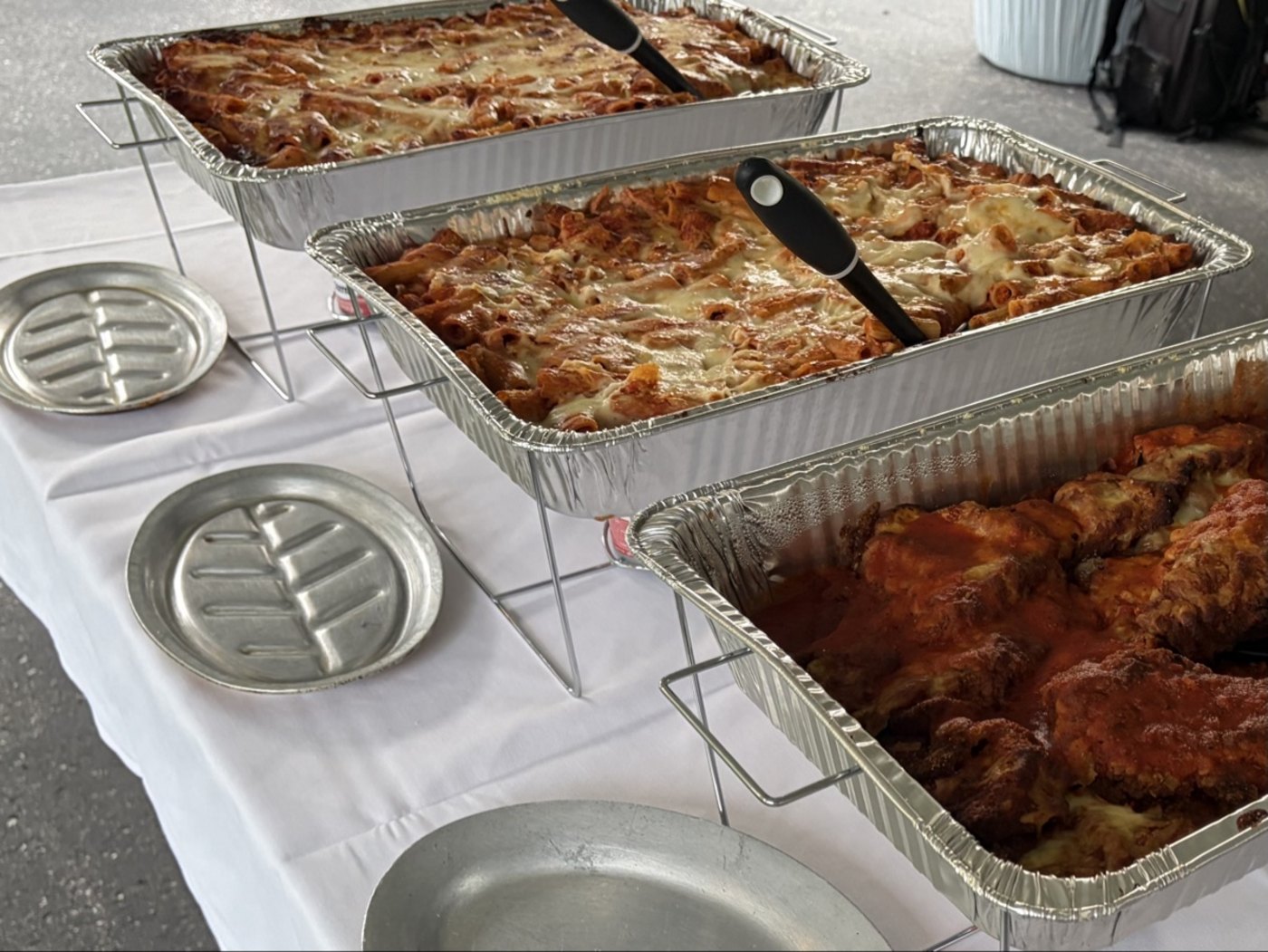 Cinelli's catering pans of baked ziti and parmigiana — Italian catering in Greece and Rochester, NY