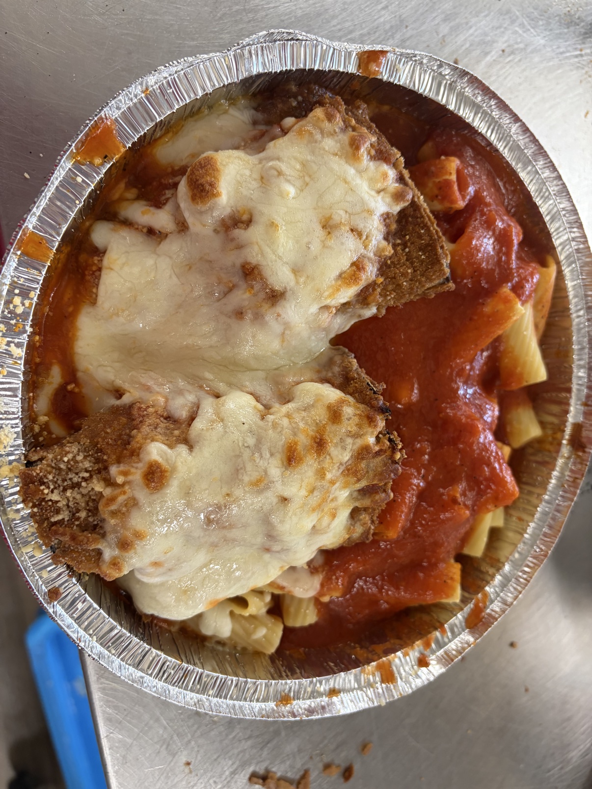 Eggplant parmesan Italian dinner with melted mozzarella, marinara, and pasta at Cinelli's in Greece, NY